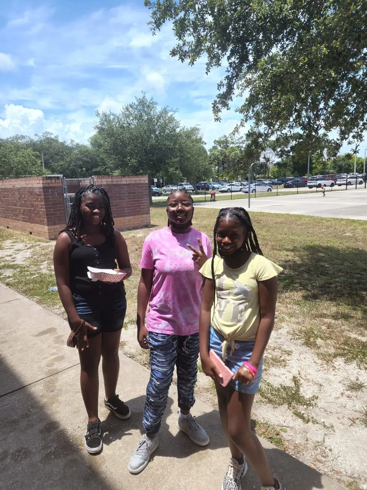 Three students together at a Strength to Elevate program day